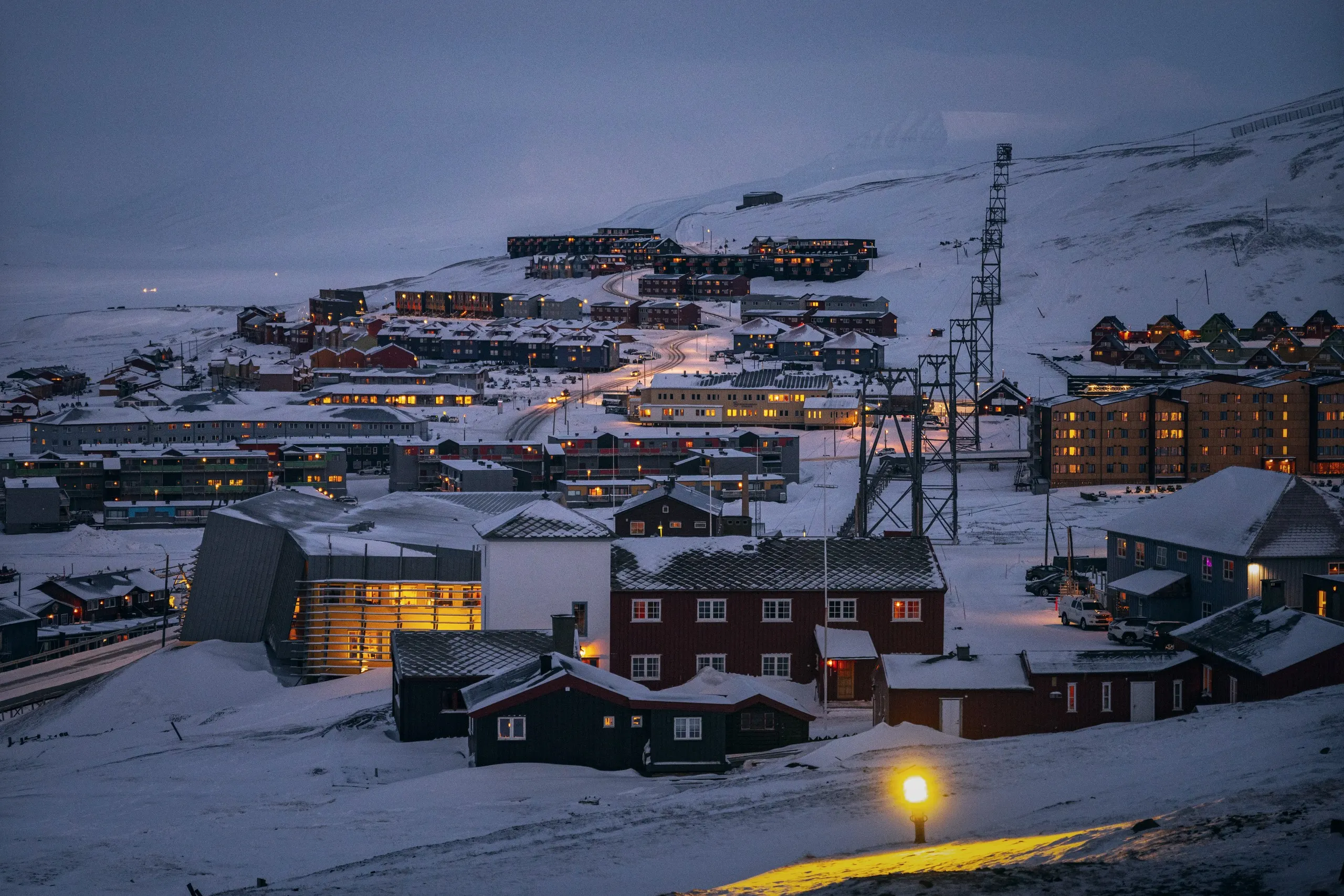 Longyearbyen houses glowing at winter twilight during the polar night