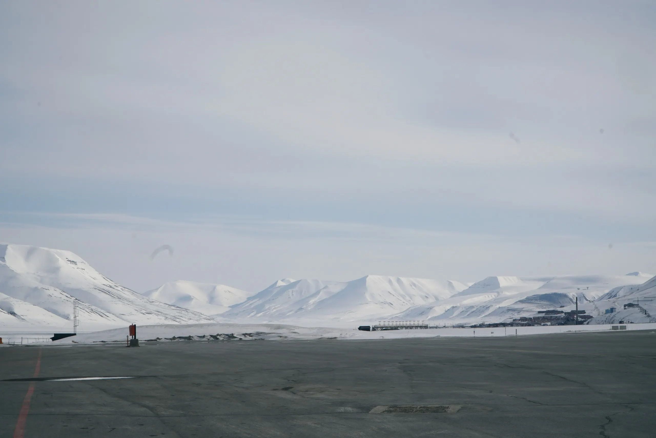 Runway and snowy mountains at Svalbard airport in Longyearbyen