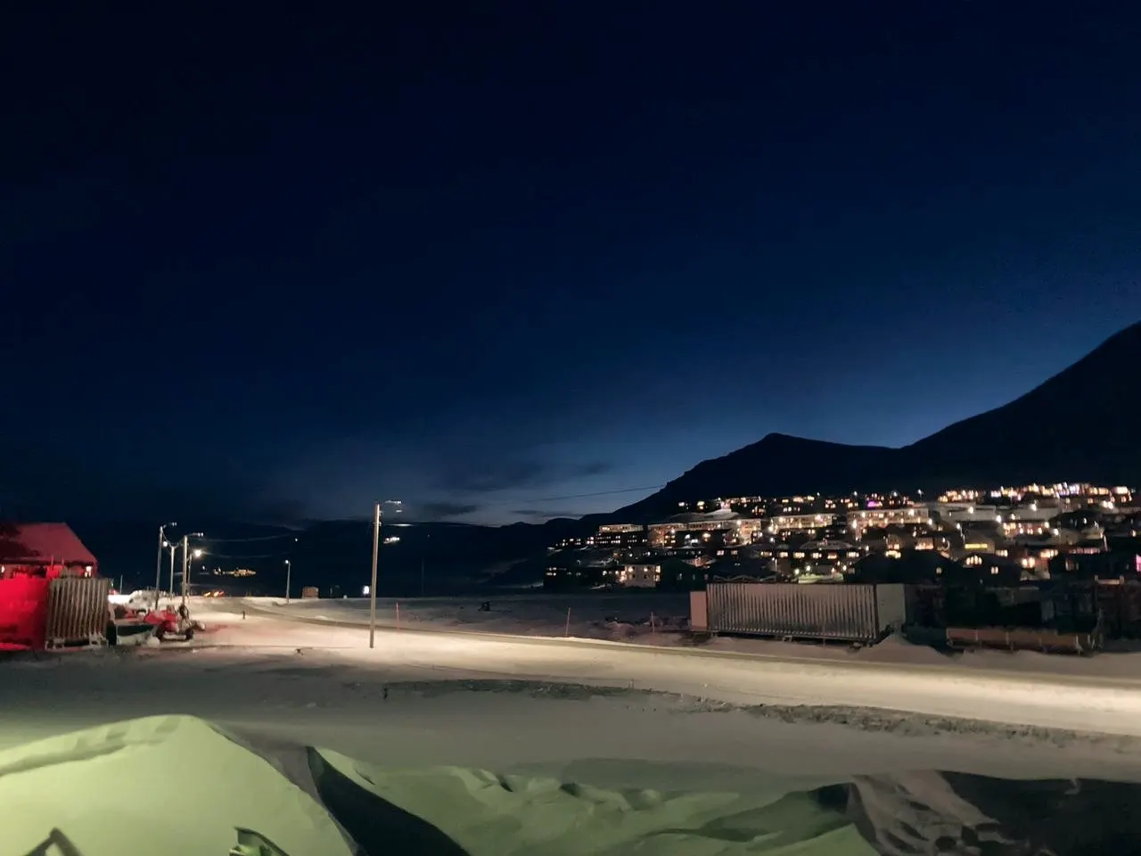 Town lights at polar-night twilight in deep winter