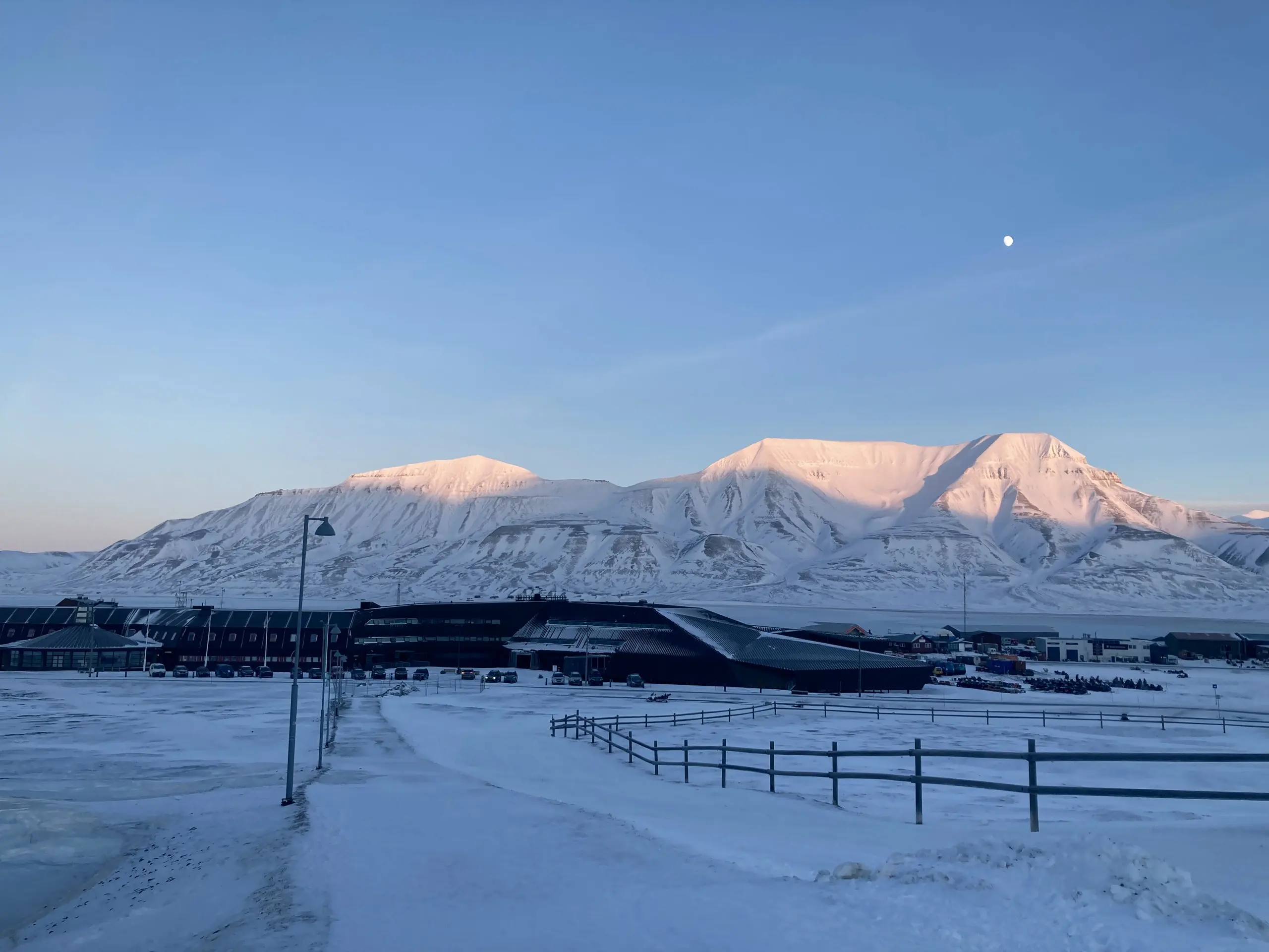 Alpenglow and the moon over Longyearbyen