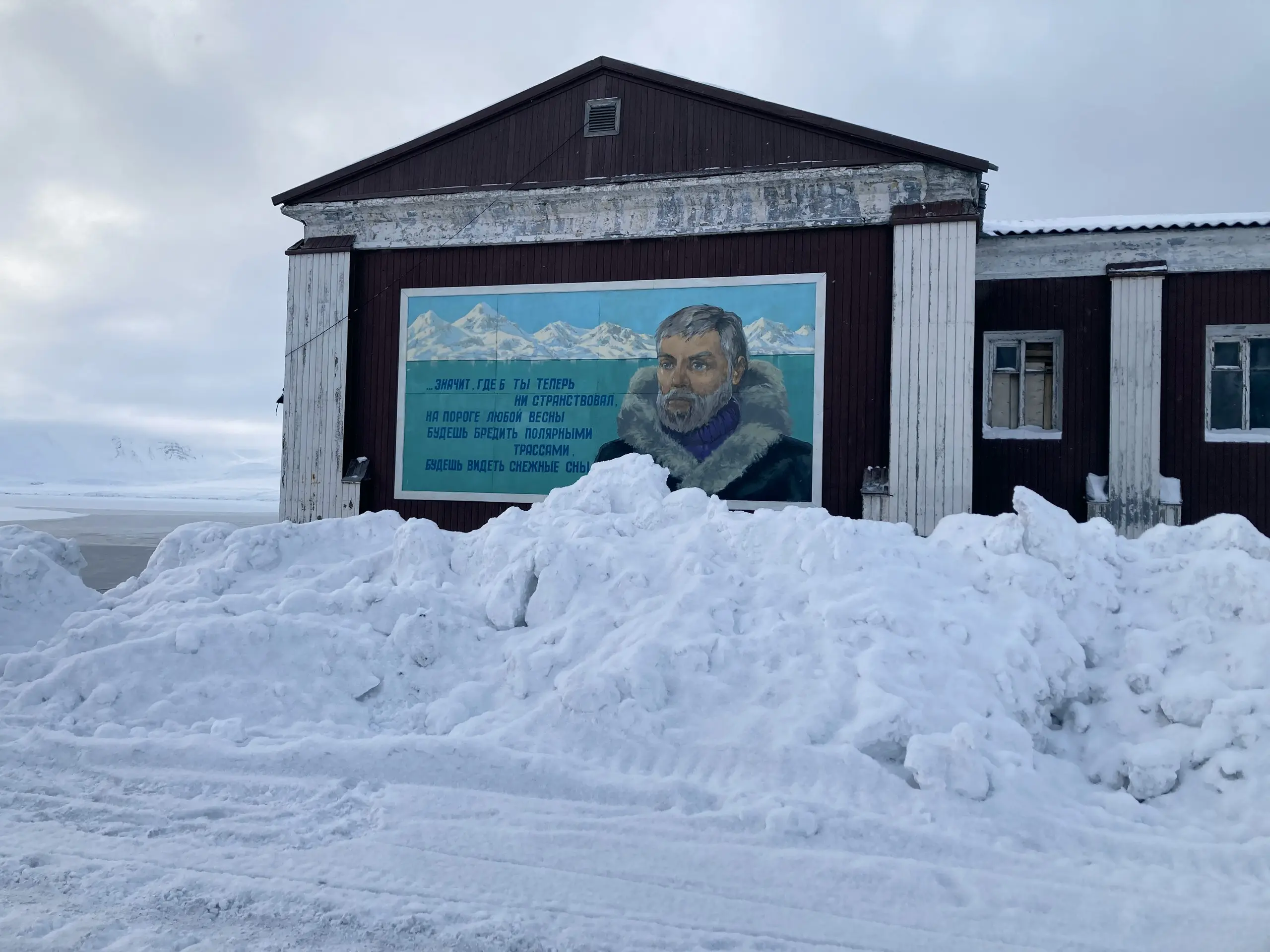 Russian explorer mural on a building wall in Barentsburg