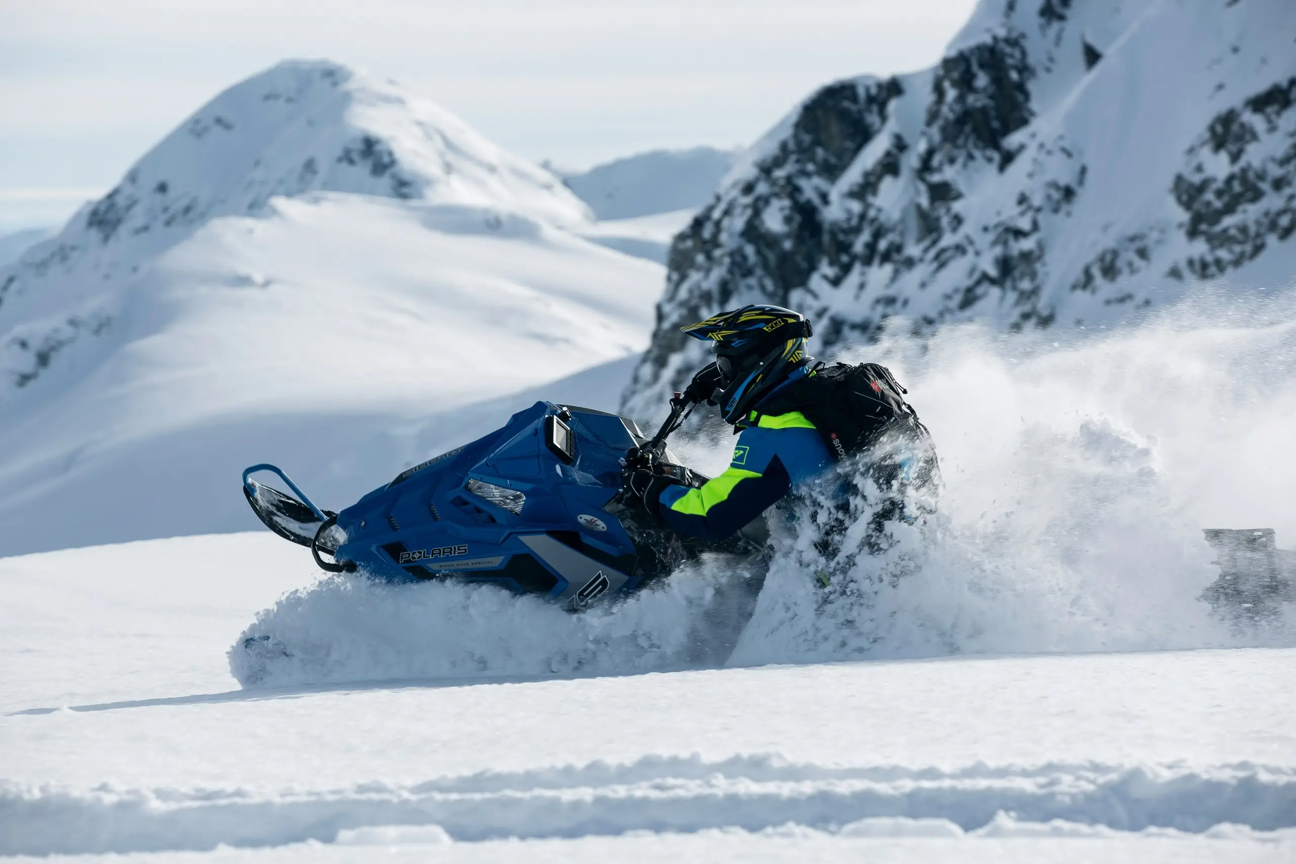 A snowmobile on a snowy Arctic trail