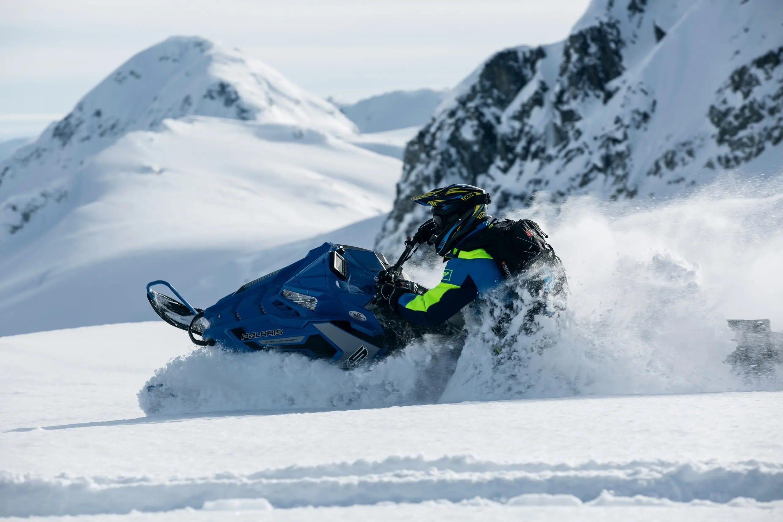 A snowmobile on a snowy Arctic trail