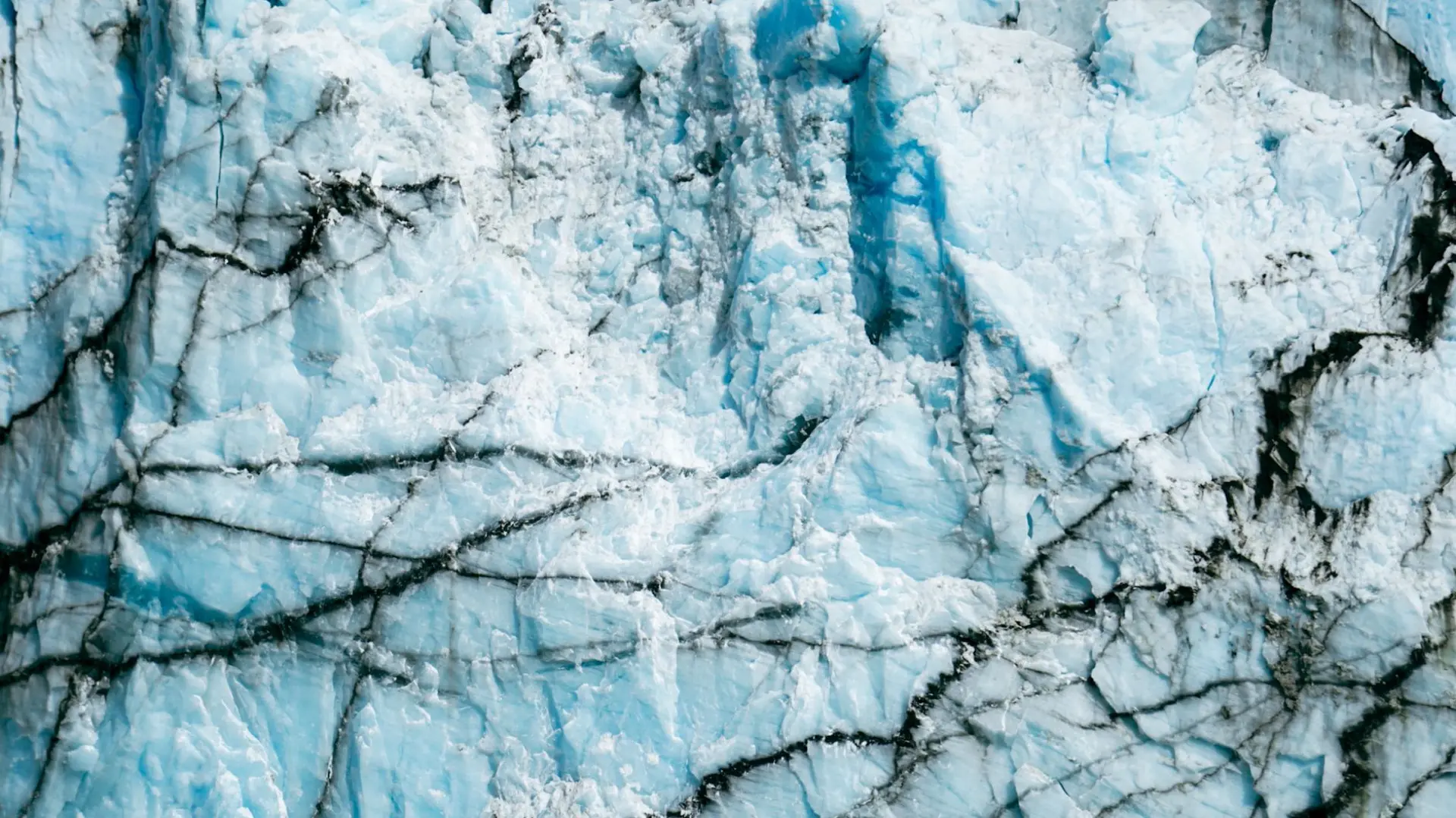 The cracked blue ice face of a Svalbard glacier